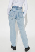 Load image into Gallery viewer, FASHION NOVA PAST AND PRESENT CROSS OVER JEANS IN LIGHT WASH