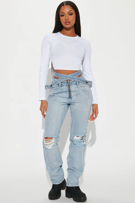 FASHION NOVA PAST AND PRESENT CROSS OVER JEANS IN LIGHT WASH